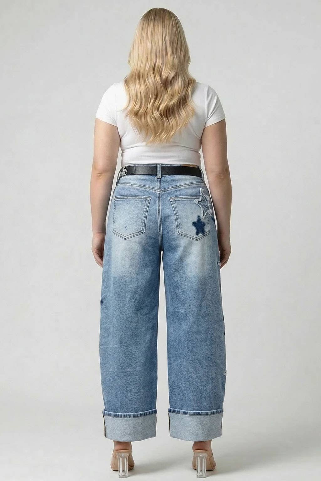 Saige light-wash high-rise cuffed star barrel jeans on model