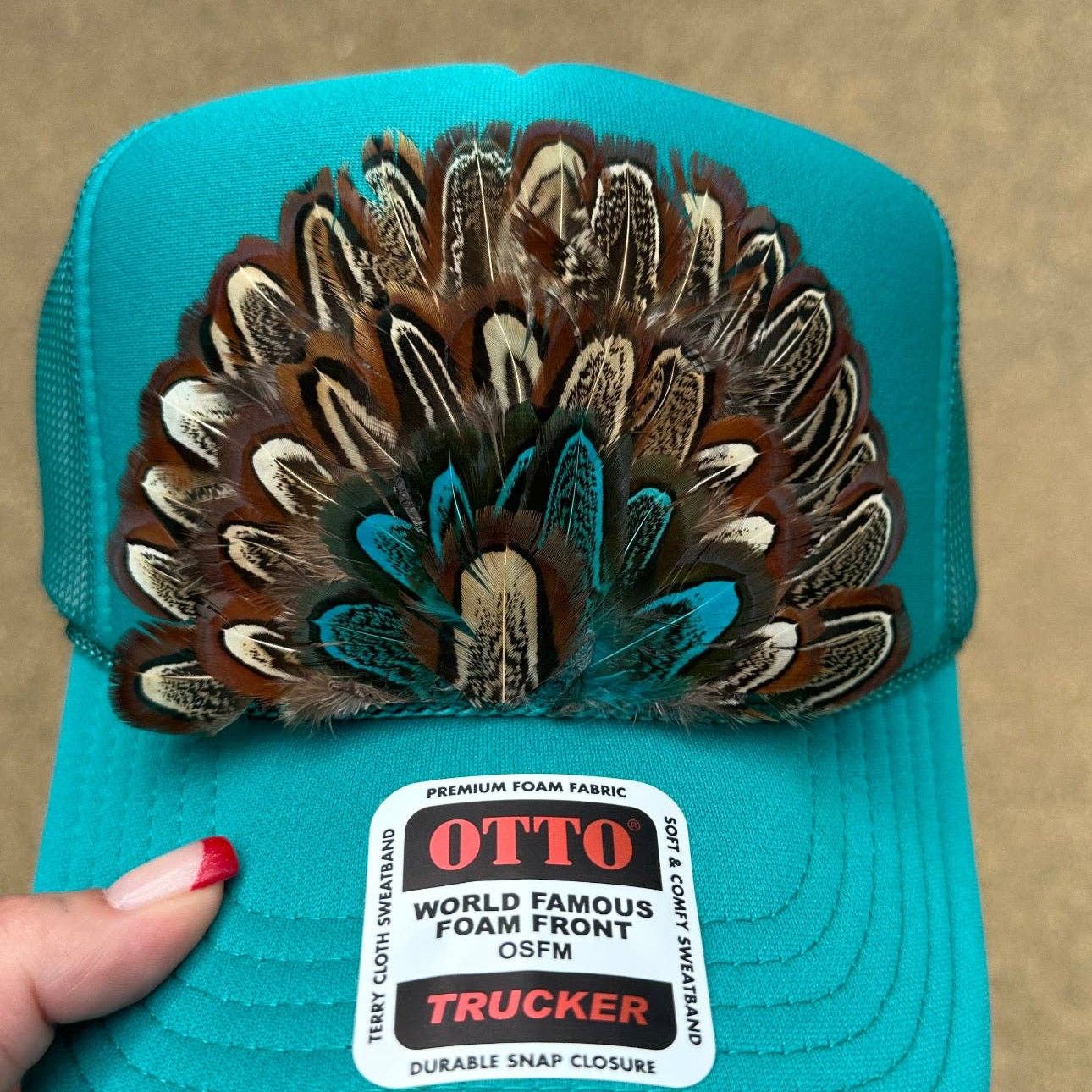 JADE FEATHER TRUCKER HAT