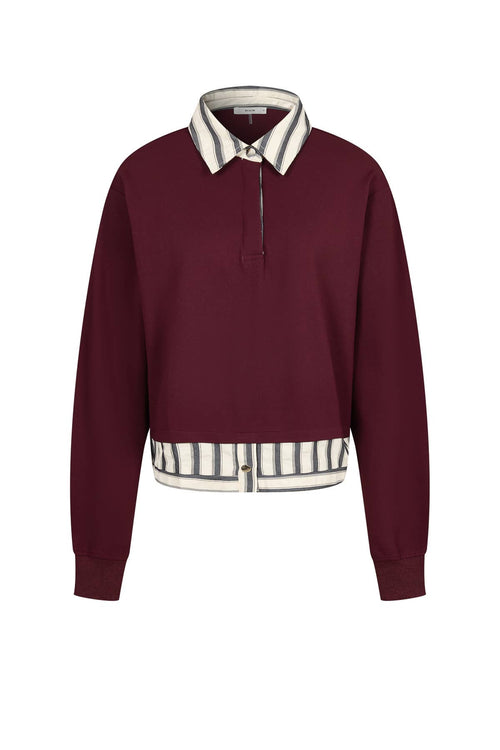 Front view of the Anette burgundy sweatshirt with striped pointed collar and layered button hem