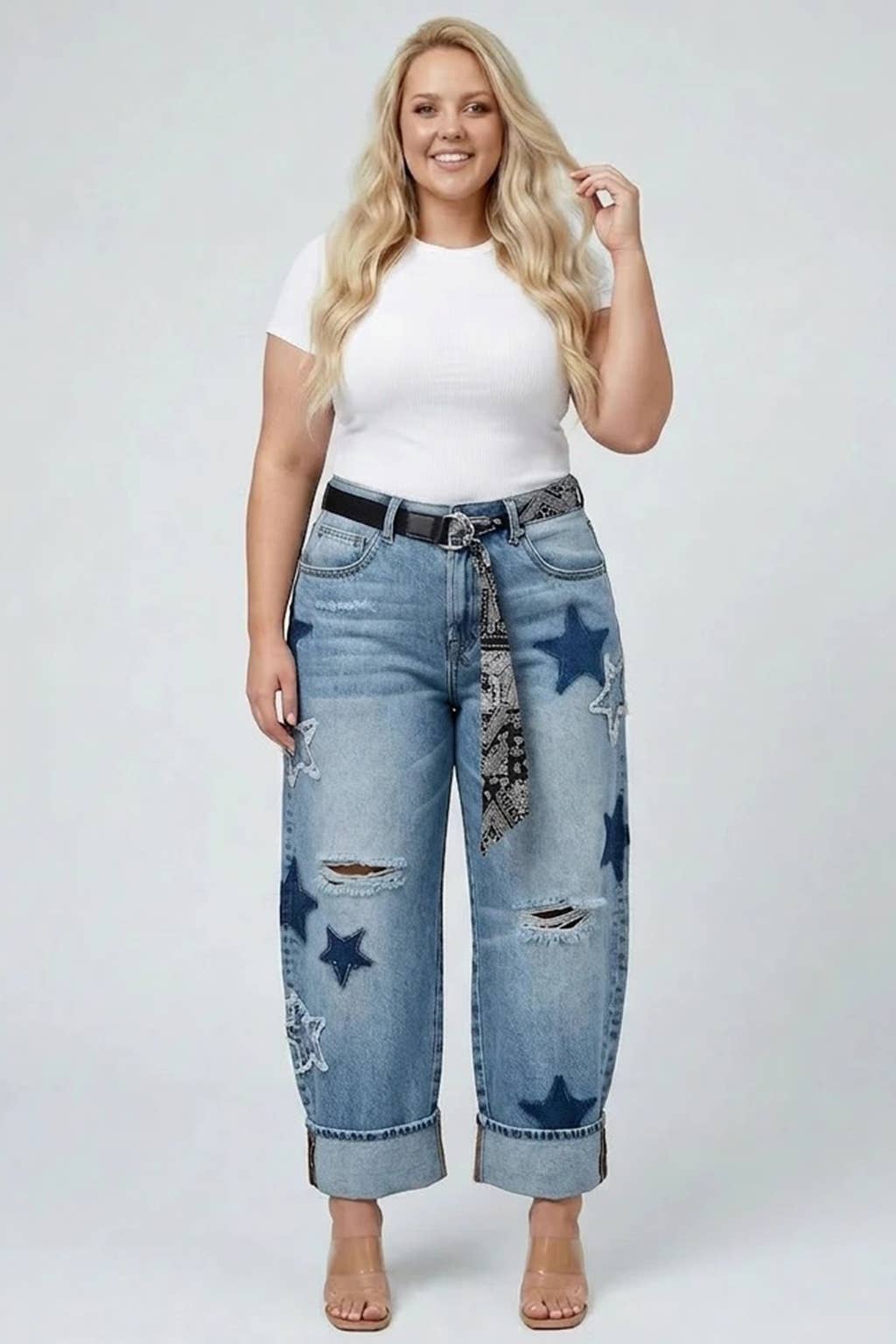 Saige light-wash high-rise cuffed star barrel jeans on model