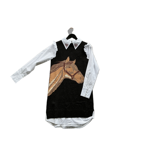 Black knit sweater vest with horse portrait design layered over a white western blouse with embroidered collar