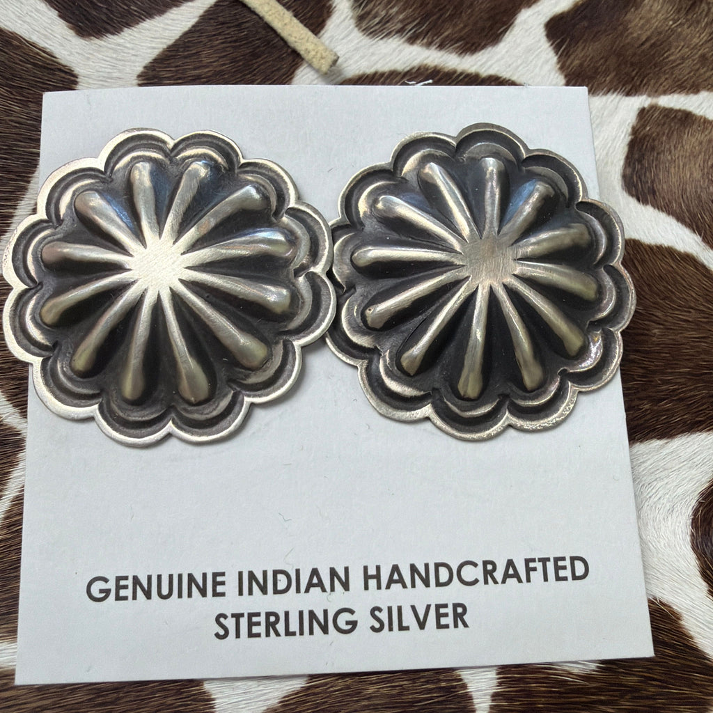 Handcrafted sterling silver concho earrings with scalloped floral design on a Genuine Indian Handcrafted Sterling Silver card