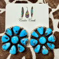 Large turquoise cluster stud earrings with sterling silver settings on a Coulee Creek branded card