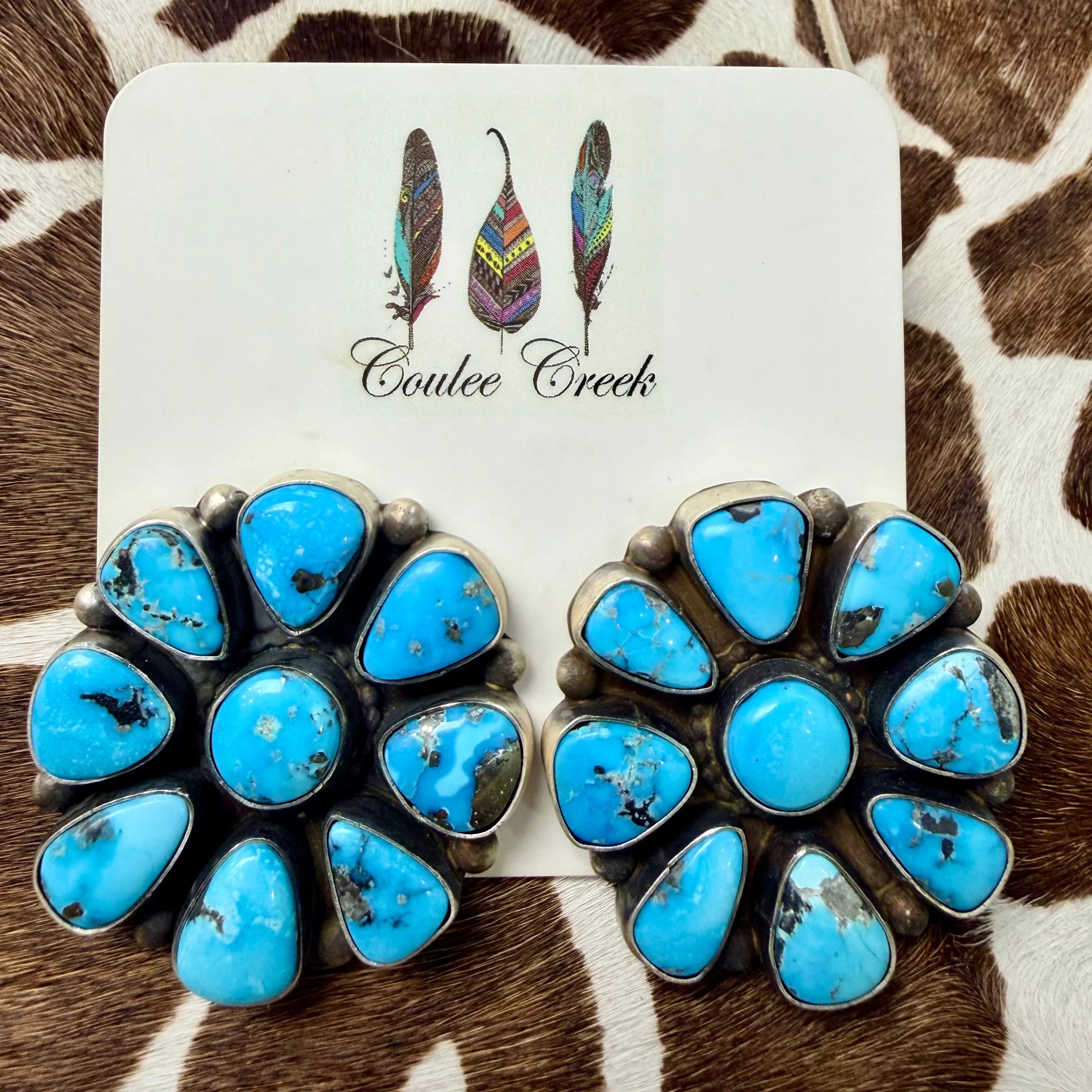 Large turquoise cluster stud earrings with sterling silver settings on a Coulee Creek branded card