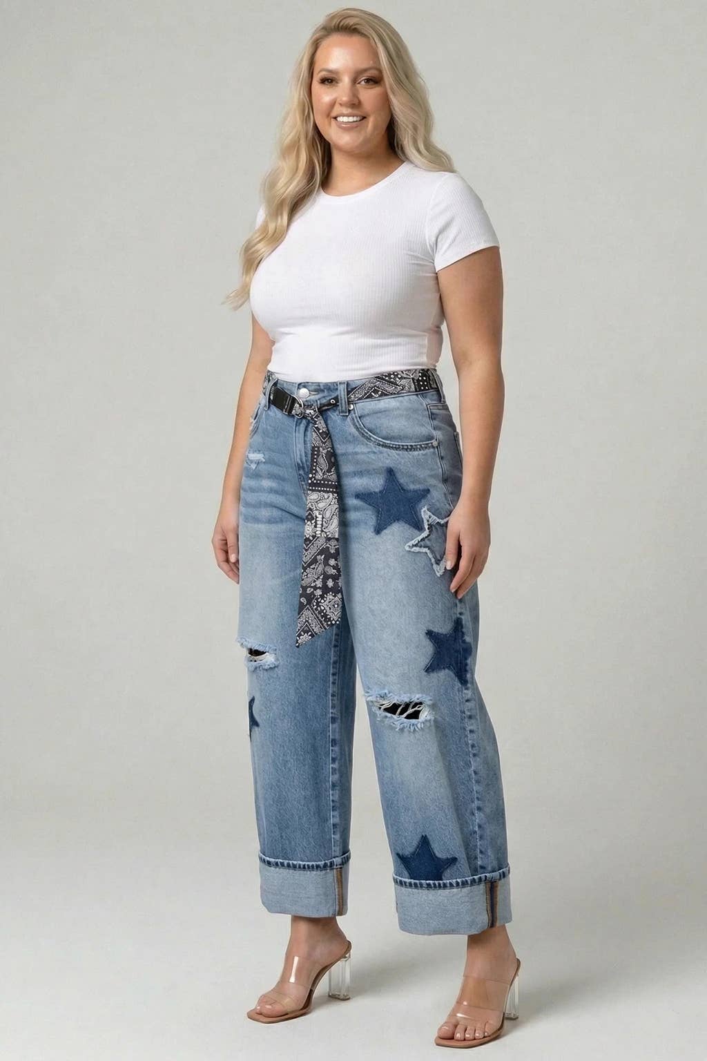 Saige light-wash high-rise cuffed star barrel jeans on model