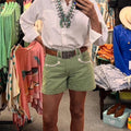 Olive Green Smiley Shorts — full-length look styled with a white western shirt and turquoise
